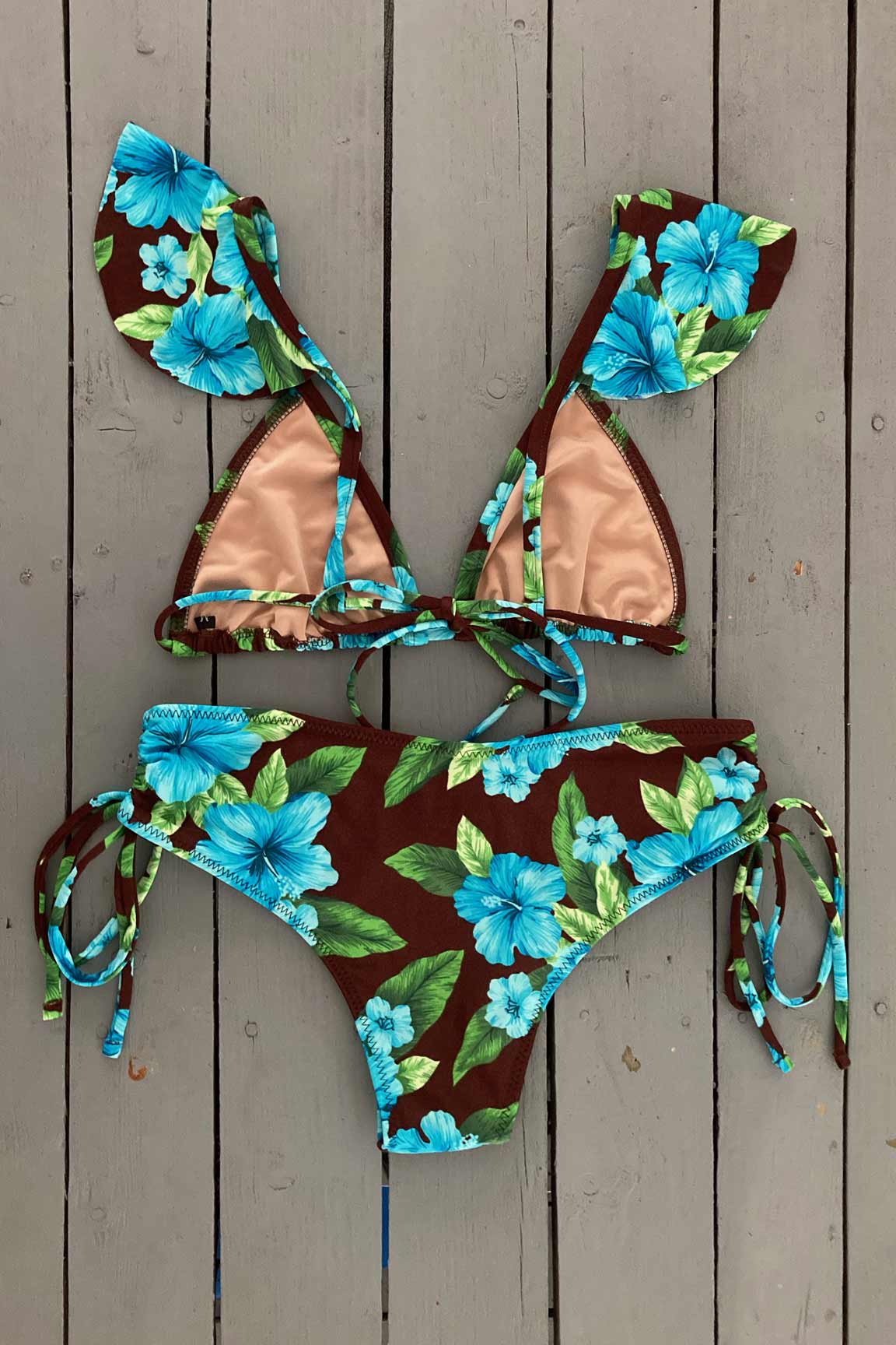 Get that tropical feeling in this triangle bikini top with ruffle accent. illes Bikinis swimwear lets women feel sexy, confident, glamorous, and comfortable all at the same time. They are made with the finest quality of soft and stretchy Lycra to achieve the best fit. Find yours @JillesBikinis