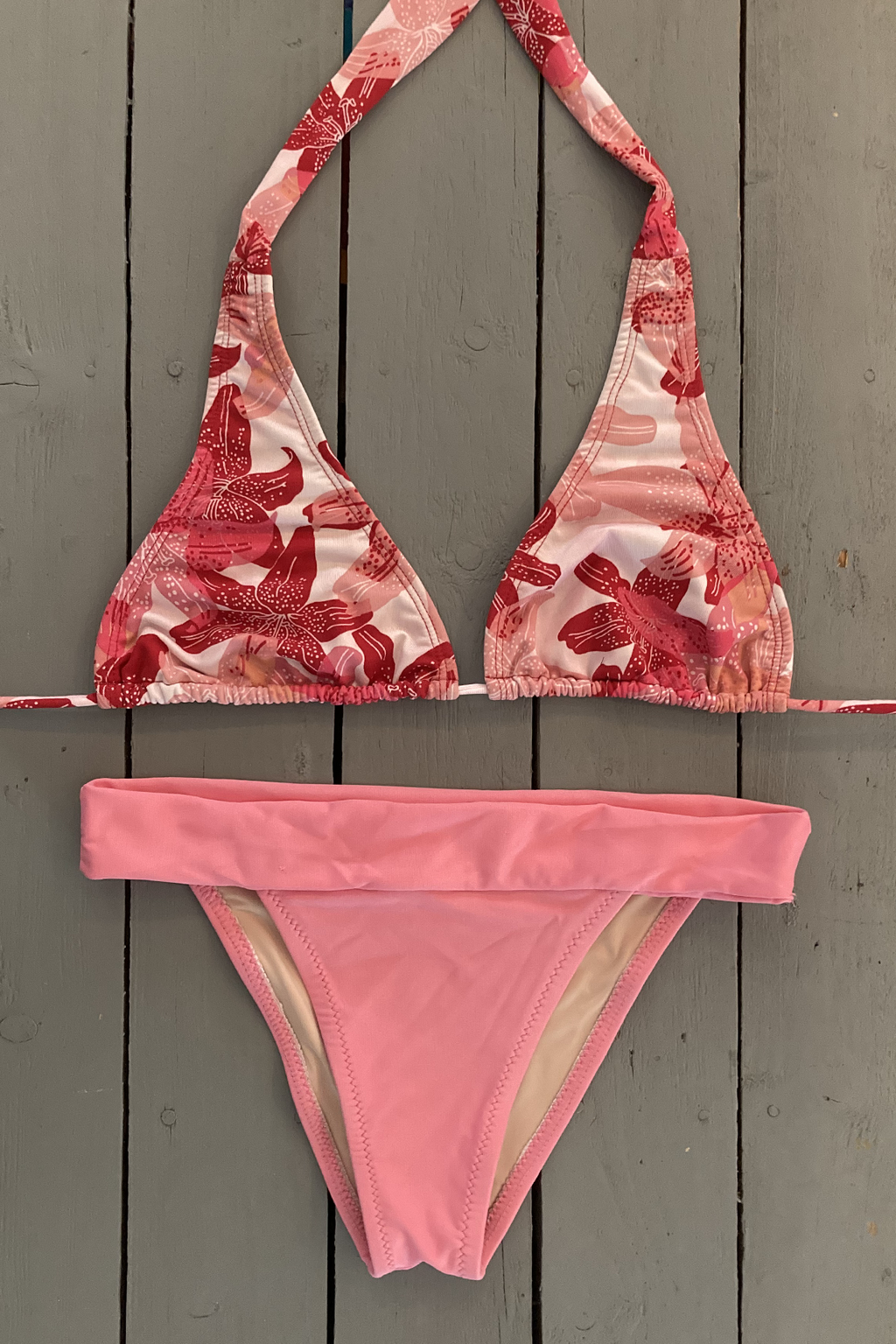 Upgrade your look with this pink floral halter bikini top. Made with the finest quality of soft and stretchy Lycra to achieve the best fit. Order yours today. @jillesbikinis  