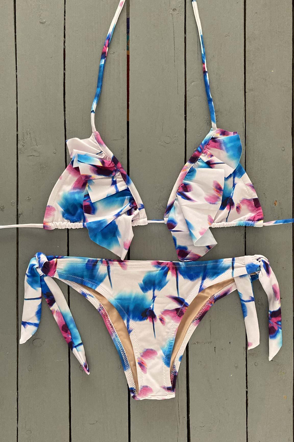 Enjoy days at the beach or pool in this floral print triangle bikini top with ruffle accent. This adjustable triangle bikini top is  made with the finest quality of soft and stretchy Lycra to achieve the best fit. Order yours today. @jillesbikinis 