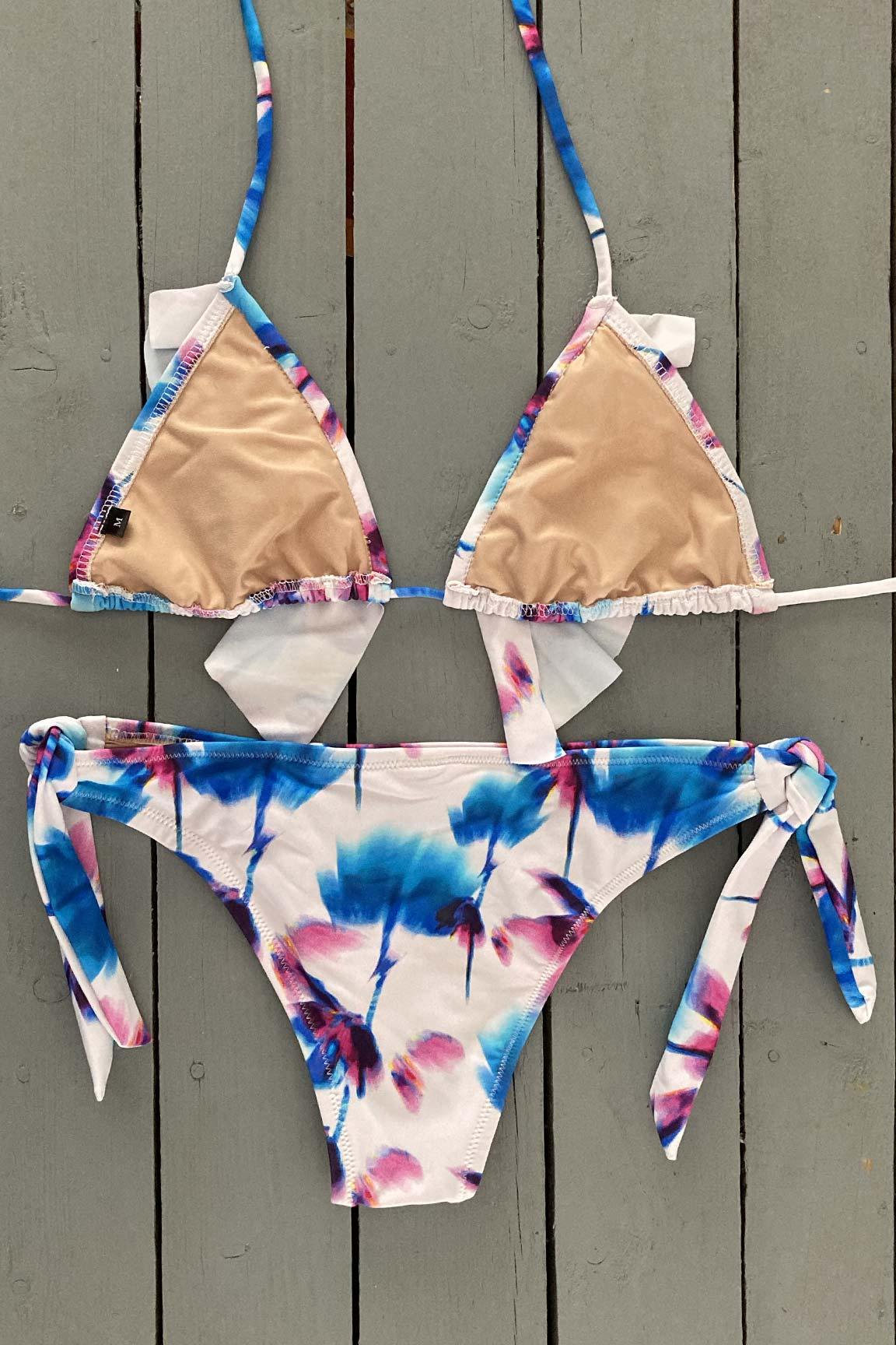 Enjoy days at the beach or pool in this floral print triangle bikini top with ruffle accent. This adjustable triangle bikini top is  made with the finest quality of soft and stretchy Lycra to achieve the best fit. Order yours today. @jillesbikinis 