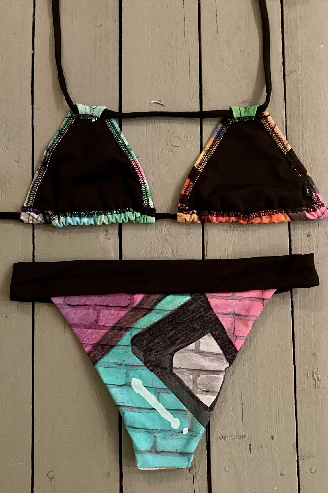 Enjoy days at the beach or pool in this Britto print double string triangle bikini top. This adjustable triangle bikini top is very versatile and can be worn in three different ways. Made with the finest quality of soft and stretchy Lycra to achieve the best fit. Order yours today. @jillesbikinis 