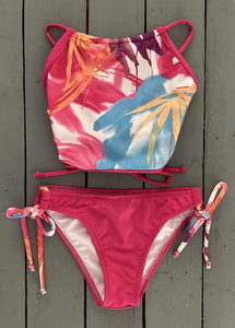 Splash around by the pool this summer in this super cute girls fuchsia adjustable, floral halter swimsuit top with tie bottoms. They are made with the finest quality of soft and stretchy Lycra to achieve the best fit. @JillesBikinis