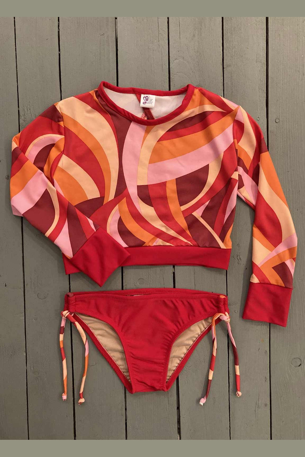 Help kids stay protected from the sun with this stylish rashguard set. The long-sleeve designs provide excellent protection from harmful UV rays. The set is made with the finest quality of soft and stretchy Lycra to achieve the best fit. Order yours today. @jillesbikinis  