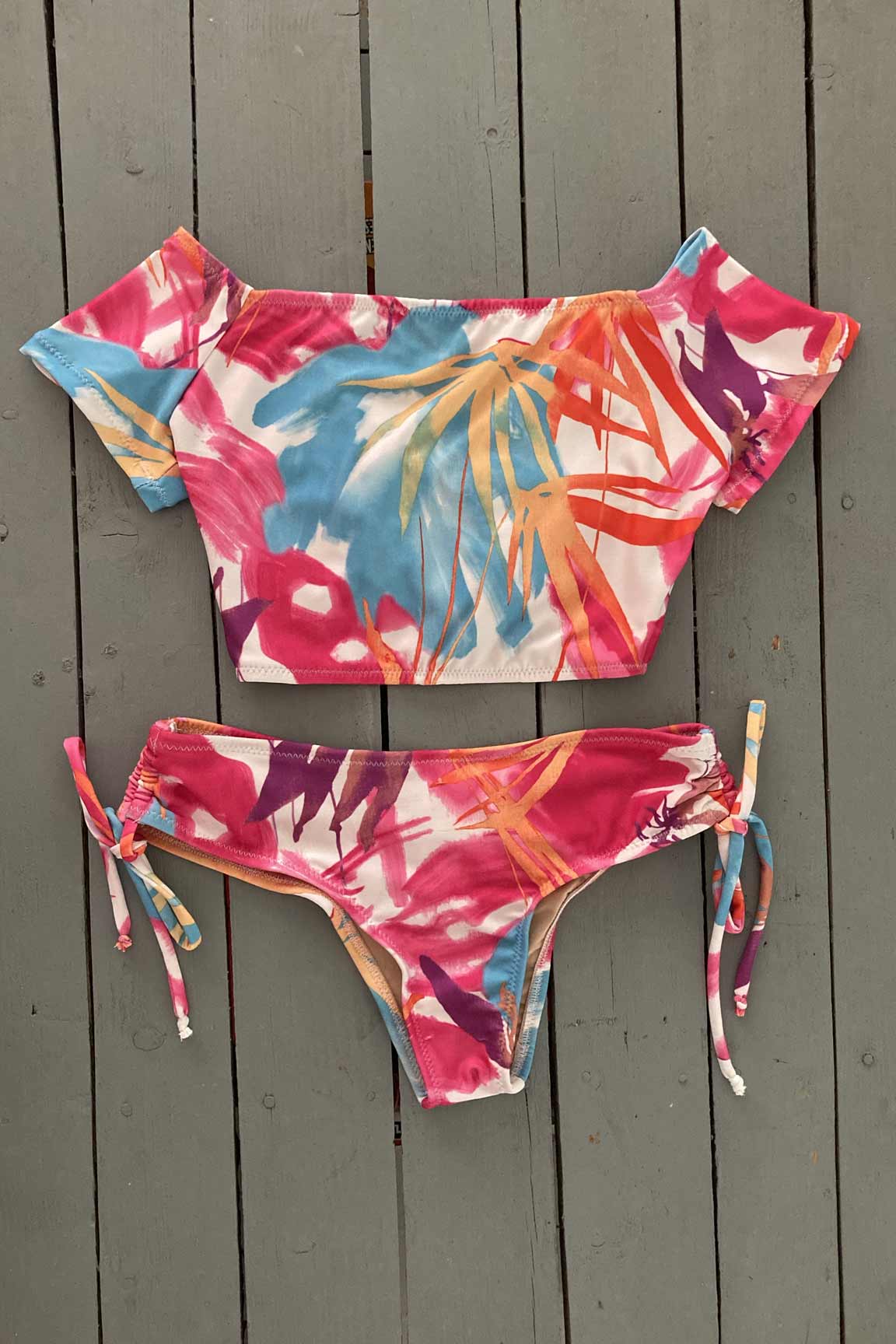 These wide cinched tie bottoms have more coverage, yet, are still sexy with a light scrunch. Very soft Lycra. Compliment your look by matching with the short sleeve bikini crop tops. Order yours today. @jillesbikinis