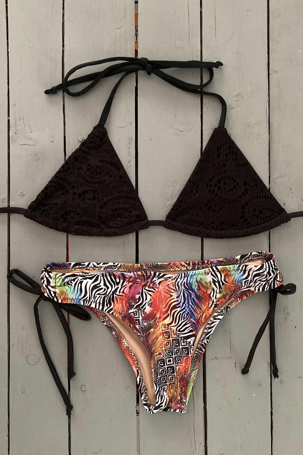 Black digital print define this triangle bikini top. Dare to be bold and wear with florals or zebra print bikini bottoms.