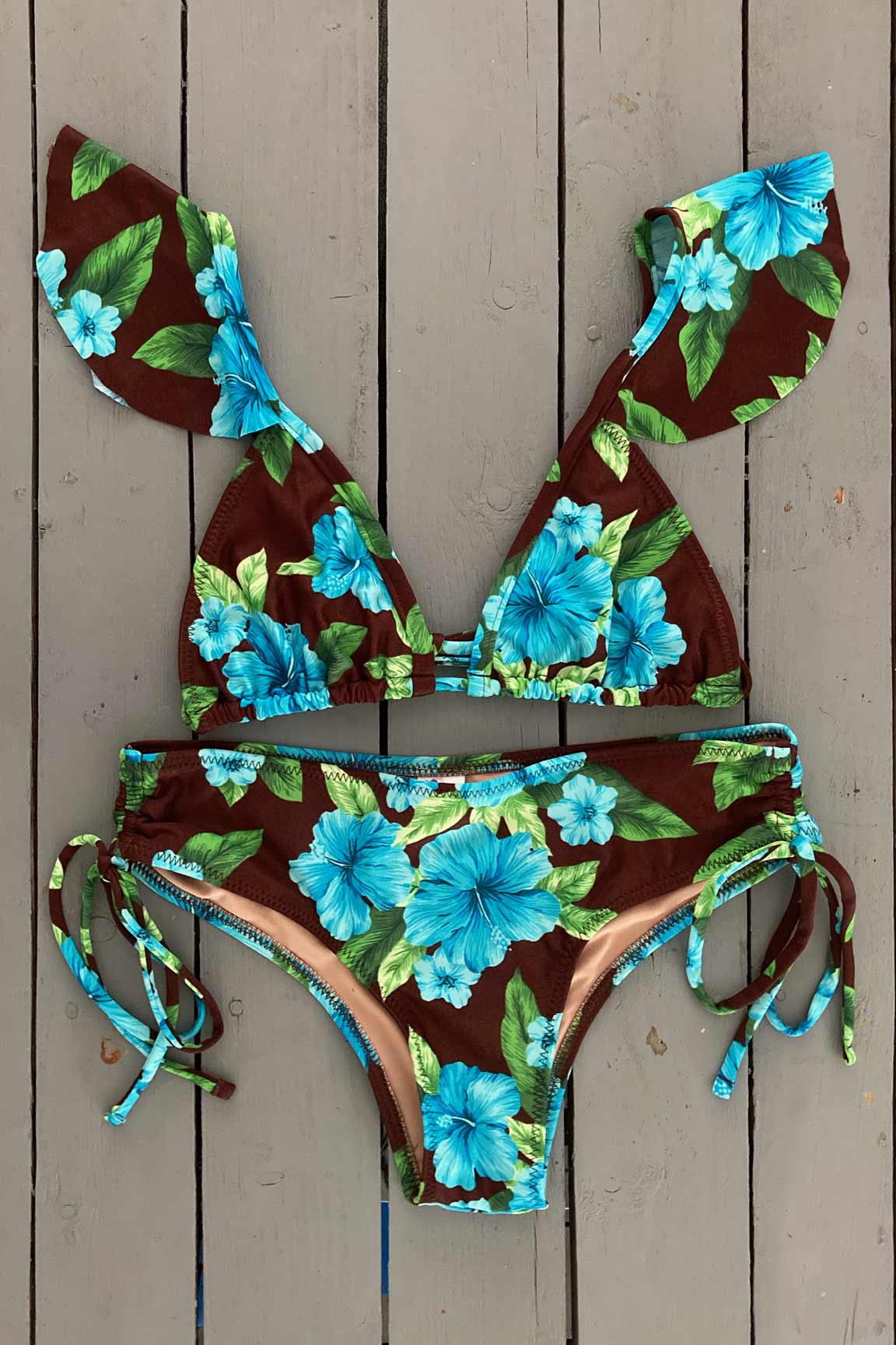 Get that tropical feeling in this triangle bikini top with ruffle accent. illes Bikinis swimwear lets women feel sexy, confident, glamorous, and comfortable all at the same time. They are made with the finest quality of soft and stretchy Lycra to achieve the best fit. Find yours @JillesBikinis