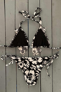 Our black and white hibiscus print triangle top has a super cute ruffle accent. A favorite style top for who want a little extra up top. Can be paired with our matching black and white spaghetti bottoms. Jilles Bikinis swimwear lets women feel sexy, confident, glamorous, and comfortable all at the same time. They are made with the finest quality of soft and stretchy Lycra to achieve the best fit.
