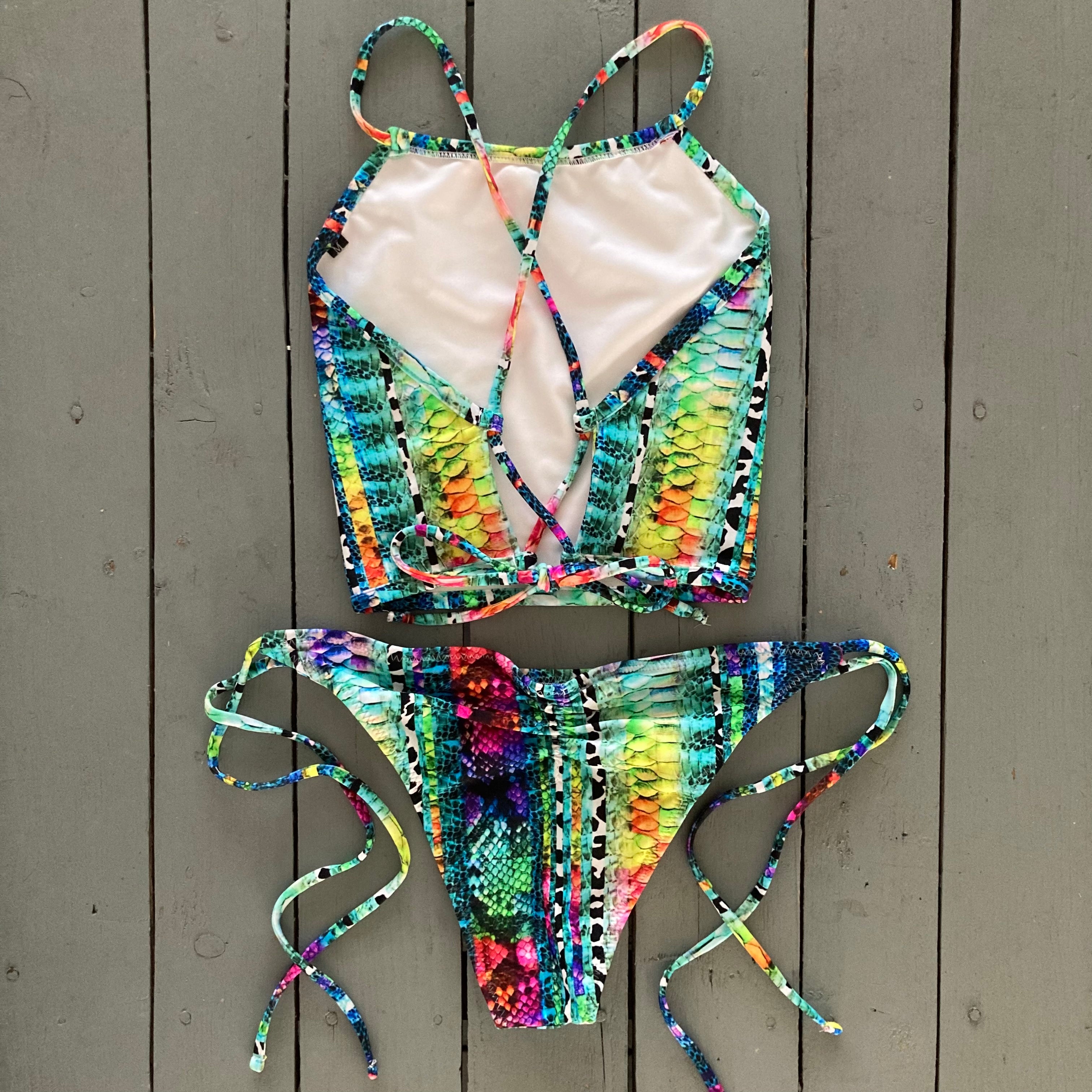 This super cute snakeskin halter top is bursting with colors. So bright and colorful and adjusts in the back for that perfect fit. Made with the finest high quality Lycra. Order yours today with a matching bright snakeskin bottom of your choice.